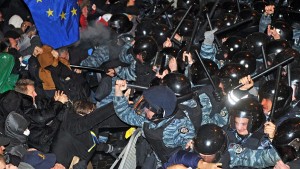 Demonstrators clash with riot police in Kiev