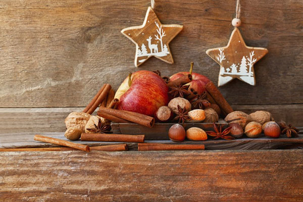 A Christmas arrangement of apples, nuts and stars
