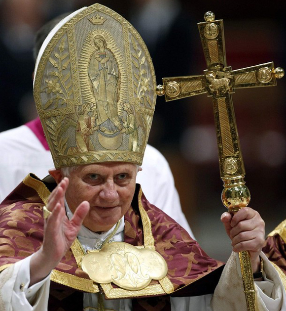 Pope Benedict XVI waves after celebrating the First Vespers in Saint Peter's Basilica at the Vatican