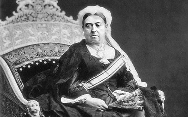 Queen Victoria , sitting on an ivory throne