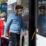 27 April 2020, Brandenburg, Potsdam: Passengers with face masks board a bus stopping at the main station. Since April 27, 2020, anyone who travels by bus or train or goes shopping in Brandenburg has had to wear a mouth and nose protection. Photo: Soeren Stache/dpa-Zentralbild/ZB